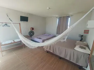 Uma cama ou camas num quarto em SeoMarujo Hostel rent a room Morro Branco