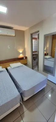 Uma cama ou camas num quarto em Flat da Claudia