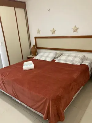 Uma cama ou camas num quarto em Eco Paradise Cumbuco pé na areia 202