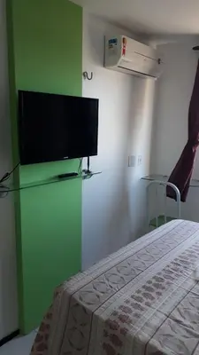 Uma televisão e/ou sistema de entretenimento em Suites Vila de Iracema