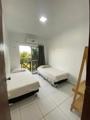 Uma cama ou camas num quarto em Apartamento Taiba!