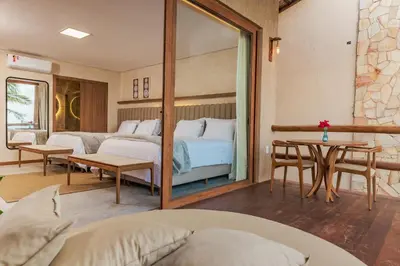 Uma cama ou camas num quarto em Pousada Kiriri