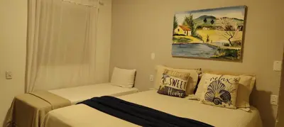 Uma cama ou camas num quarto em Chalés da Cris