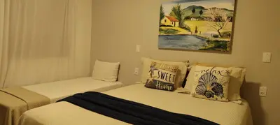 Uma cama ou camas num quarto em Chalés da Cris