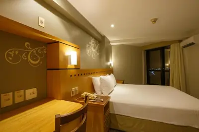 Uma cama ou camas num quarto em Blue Tree Towers Fortaleza Beira Mar