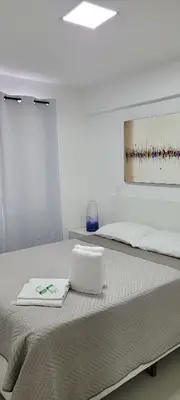 Uma cama ou camas num quarto em Beira mar Meireles a um passo do mar