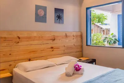 Uma cama ou camas num quarto em Pousada Cactus Jeri