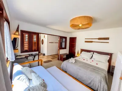 Uma cama ou camas num quarto em AKY JERI - POUSADA Vila de Jericoacoara