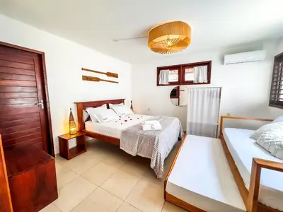 Uma cama ou camas num quarto em AKY JERI - POUSADA Vila de Jericoacoara