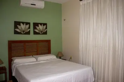 Uma cama ou camas num quarto em Pousada Recreio Casa Grande