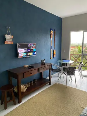 Uma televisão e/ou sistema de entretenimento em Apto Praia da Taíba Vista Mar