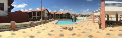 A piscina em ou perto de Linda casa Porto das Dunas: 4 suítes, churrasqueira e piscina