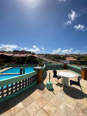 A piscina em ou perto de Linda casa Porto das Dunas: 4 suítes, churrasqueira e piscina