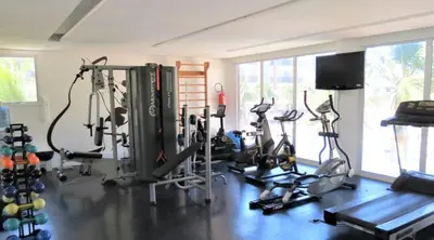 O centro de fitness e/ou as comodidades de fitness de Beach Living - Porto das Dunas - Ap Terreo 200m Beach Park PÉ NA AREIA