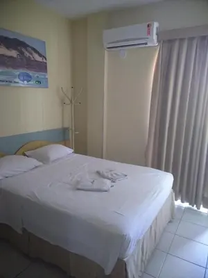 Uma cama ou camas num quarto em Condomínio Flat La Perla