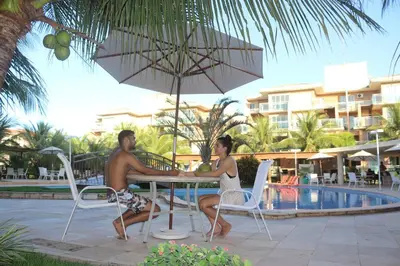 A piscina em ou perto de PALM BEACH Porto das Dunas, apartamento todo climatizado TÉRREO a 350 metros Beach Park