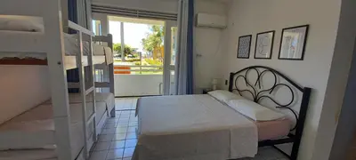 Uma cama ou camas num quarto em Ap 2 qts - Fortaleza - Praia do Futuro - Piscinas - WiFi - Ar-cond - Garagem