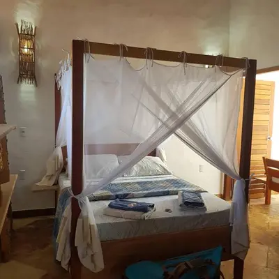 Uma cama ou camas num quarto em Villa Cajuiero Inn