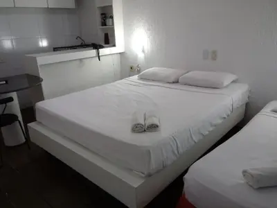 Uma cama ou camas num quarto em Tabajara Flats Praia de Iracema