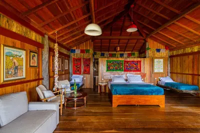 Uma cama ou camas num quarto em Villa Papagaio
