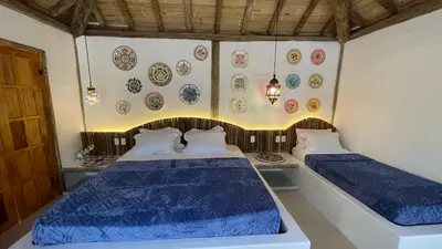Uma cama ou camas num quarto em Villa Papagaio