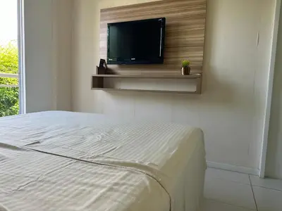 Uma cama ou camas num quarto em Palm Beach Residence