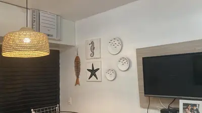 Uma televisão e/ou sistema de entretenimento em Eco Paradise Cumbuco frente mar 201