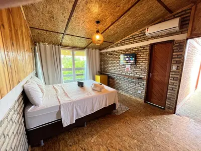 Uma cama ou camas num quarto em Villa Flecheiras