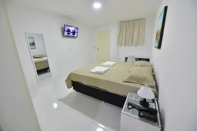 Uma cama ou camas num quarto em LIVE IN FORTALEZA HOTEL