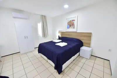 Uma cama ou camas num quarto em LIVE IN FORTALEZA HOTEL