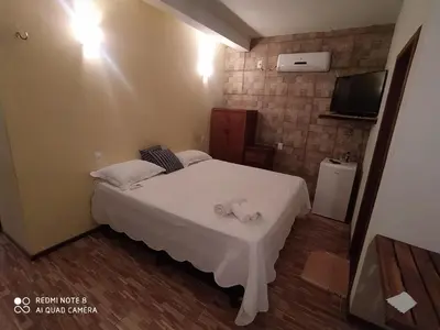 Uma cama ou camas num quarto em Pousada A Casinha