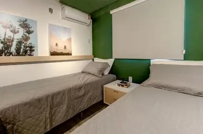 Uma cama ou camas num quarto em Porto Iracema #1112 - Apê moderno por Carpediem
