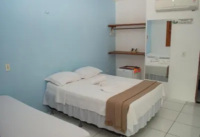 Uma cama ou camas num quarto em Pousada Numei de Jeri