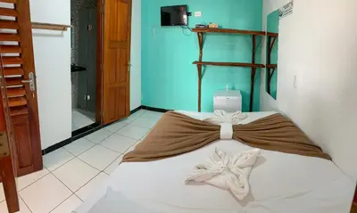 Uma cama ou camas num quarto em Pousada Numei de Jeri