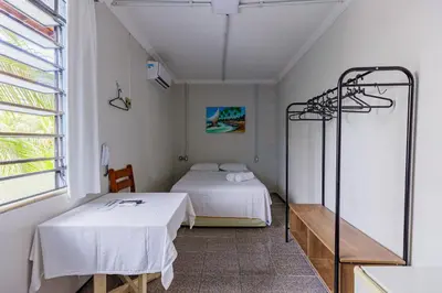 Uma cama ou camas num quarto em Hotel Meireles