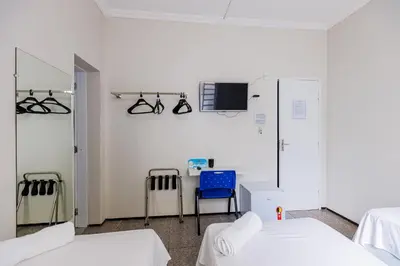 Uma cama ou camas num quarto em Hotel Meireles