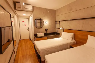 Uma cama ou camas num quarto em ibis Caucaia Porto do Pecem