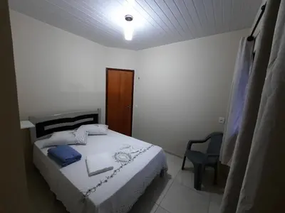Uma cama ou camas num quarto em Casa Neto&Lu