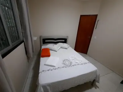 Uma cama ou camas num quarto em Casa Neto&Lu