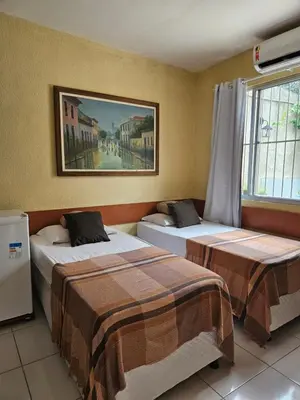 Uma cama ou camas num quarto em House755 Hospedaria