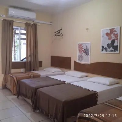 Uma cama ou camas num quarto em House755 Hospedaria