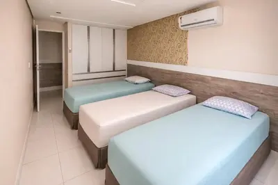 Uma cama ou camas num quarto em Excelente Apartamento Sofisticado na Praia do Futuro
