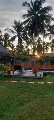 Um jardim no exterior de Pousada Flor de Lena Icaraizinho - Suíte Jasmim