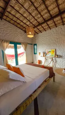 Uma cama ou camas num quarto em Mangará Pousada