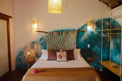 Uma cama ou camas num quarto em Mangará Pousada