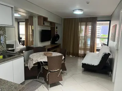Uma televisão e/ou sistema de entretenimento em LANDSCAPE - Apartamento Mobiliado na Beira Mar