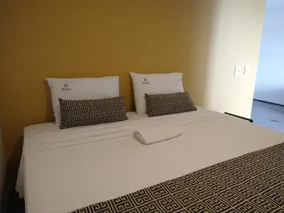 Uma cama ou camas num quarto em Iracema Flat 501 Fortaleza