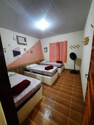 Uma cama ou camas num quarto em casa praia de guajiru