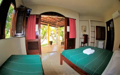 Uma cama ou camas num quarto em Paracuru Kite Village