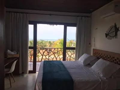 Uma cama ou camas num quarto em UMAMI RESIDENCE
